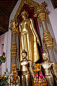 Thailand, Phra Pathom Chedi, the nation's largest pagoda in Nakorn Pathom. Buddha statue in one wiharn of the outer couryard.